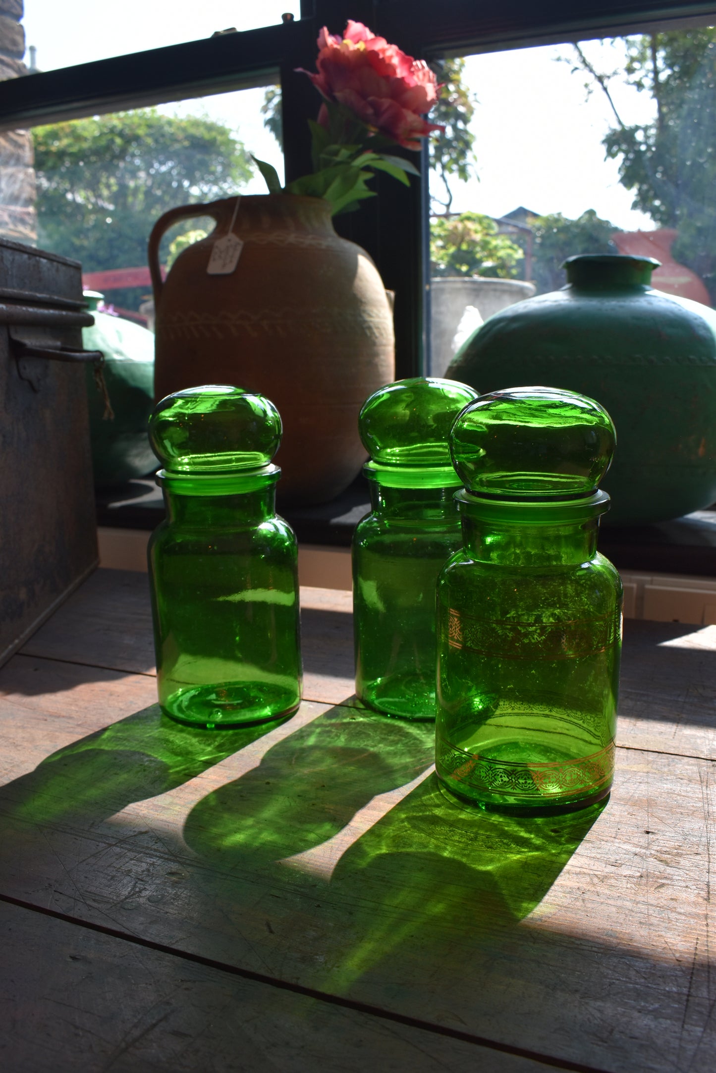 Three Green Pharmacy Bottles